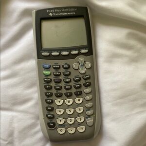 Texas Instruments Graphing Calculator in Silver and Gray